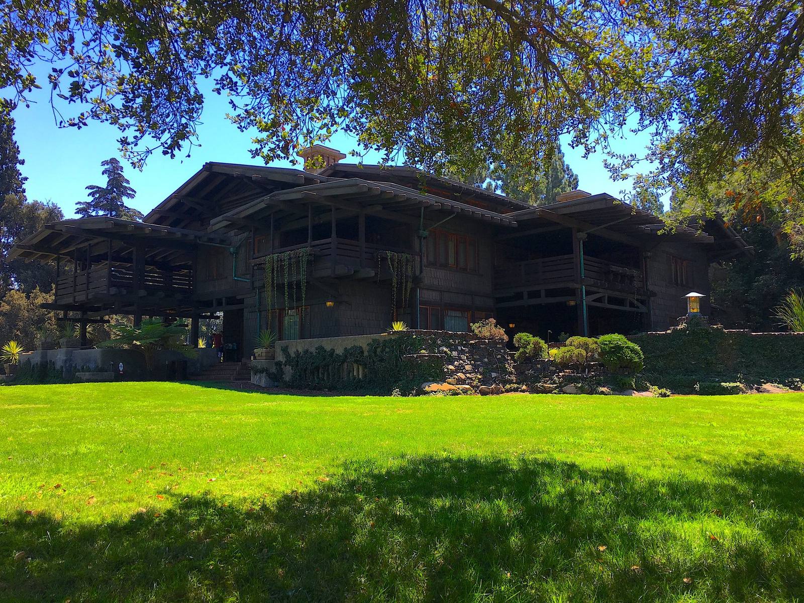 The Gamble House, Pasadena, seen from the lawn with its broad eaves and redwood shakes