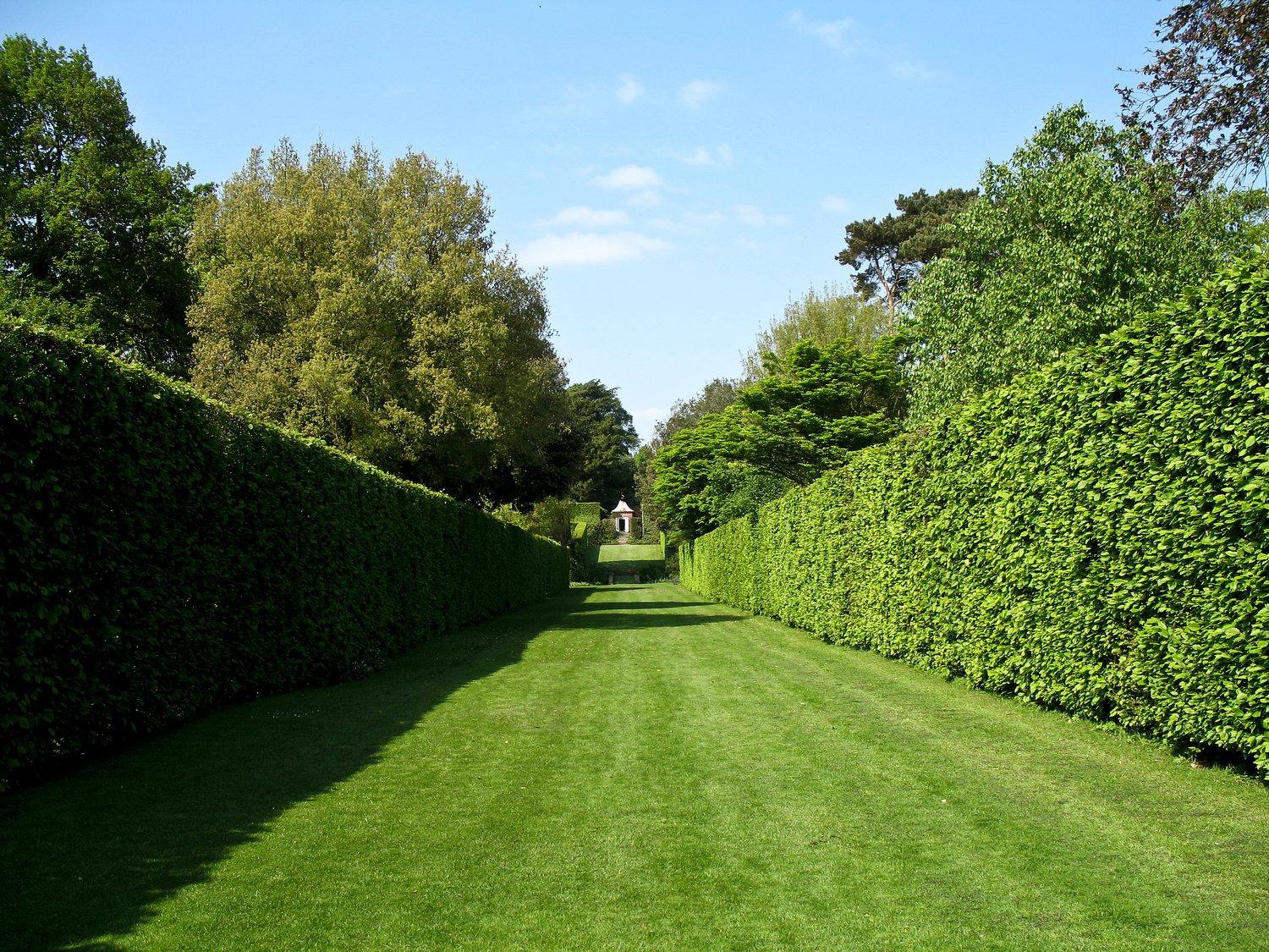 The Long Walk at Hidcote Manor Garden, looking north between tall hedges toward a gazebo