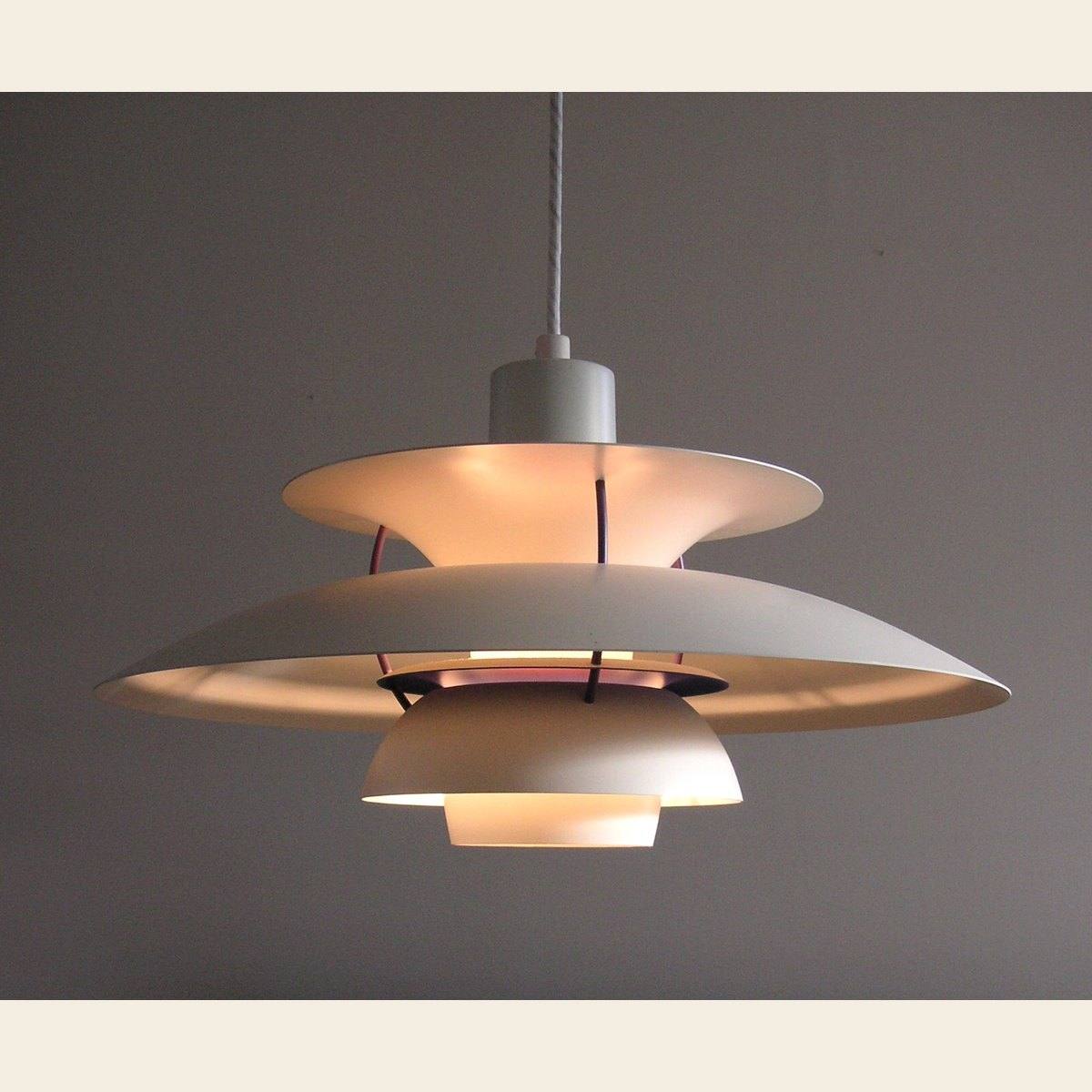 A PH 5 pendant lamp by Poul Henningsen, shown lit