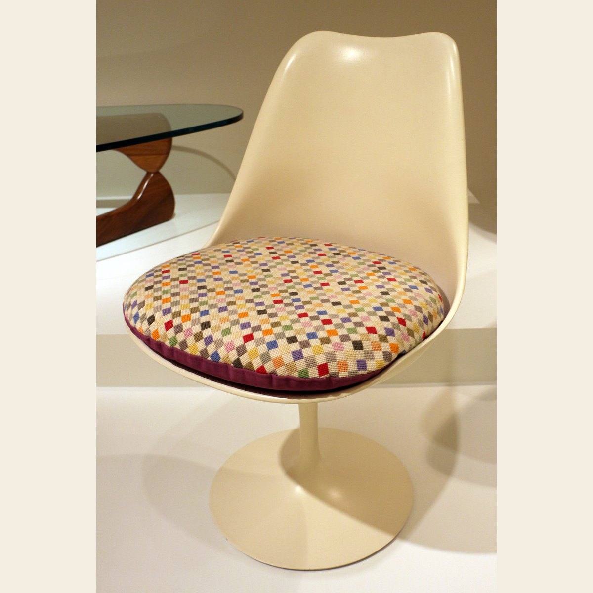 The Tulip armchair from Eero Saarinen's Pedestal collection, photographed in a museum collection