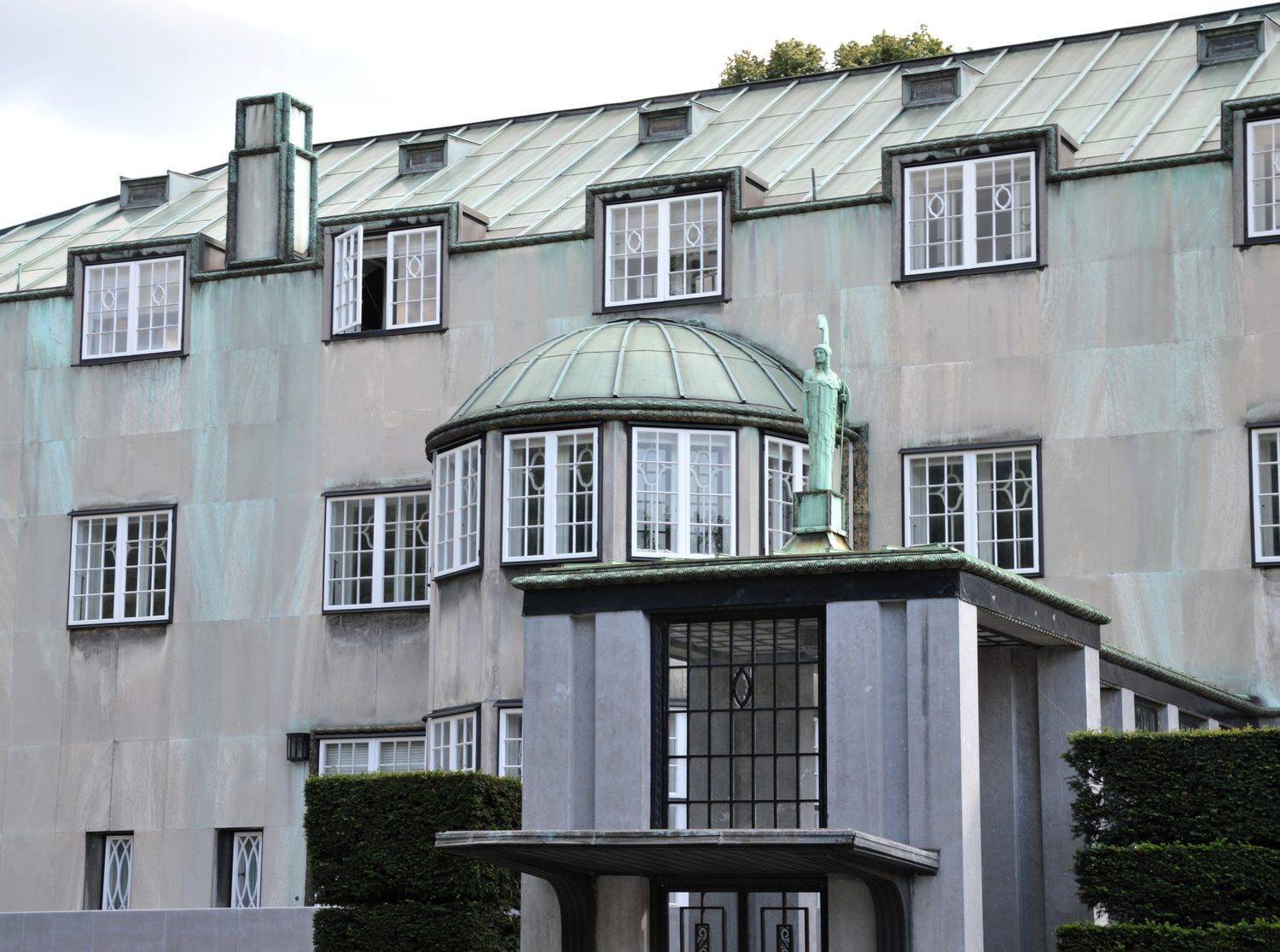 The entrance front of the Palais Stoclet, Brussels, with its copper-domed bay and bronze trim