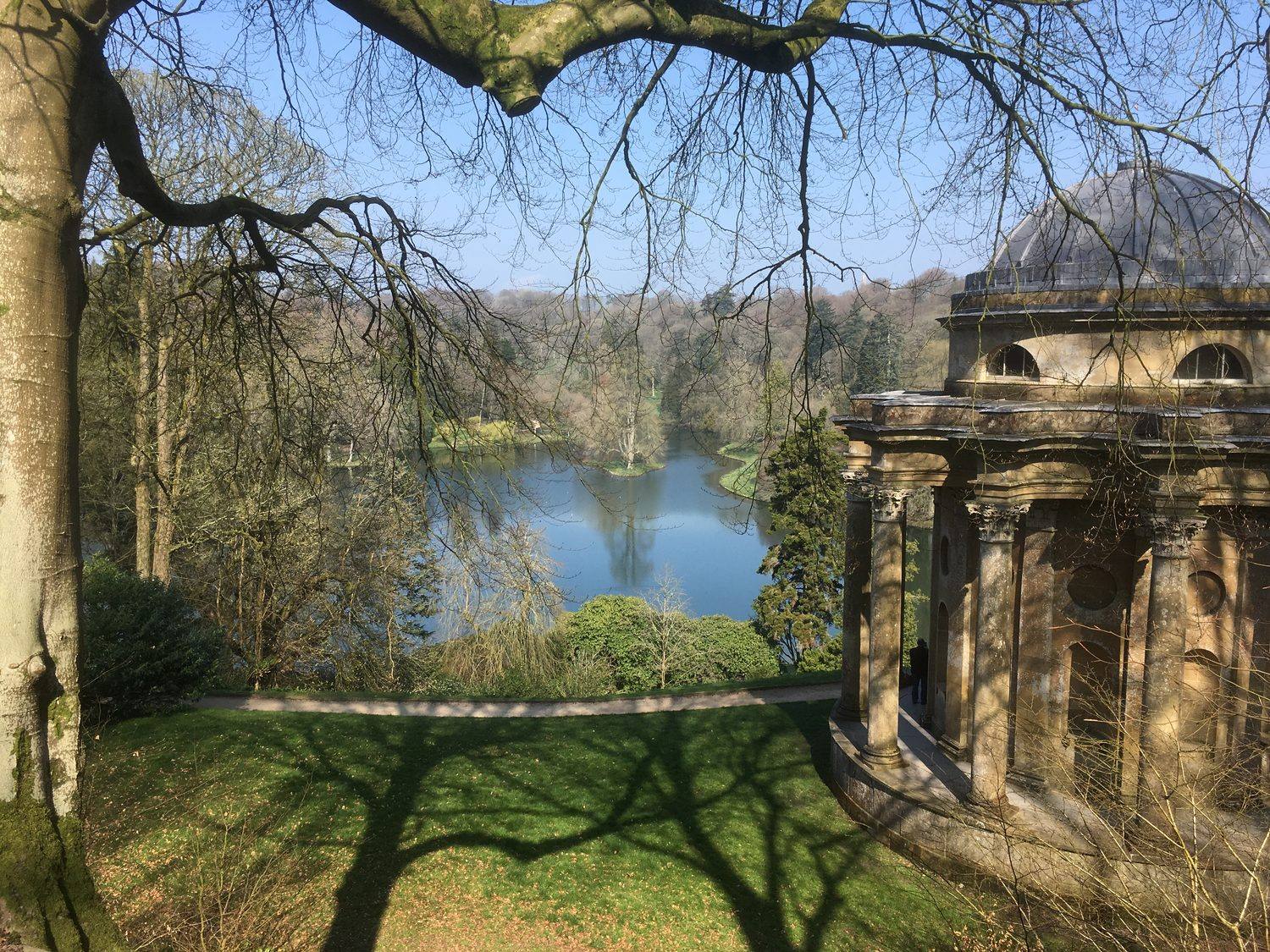 Stourhead garden, the Temple of Apollo above the lake in winter light