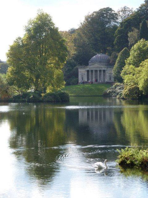 Stourhead garden, the Pantheon seen across the lake with a swan in the foreground