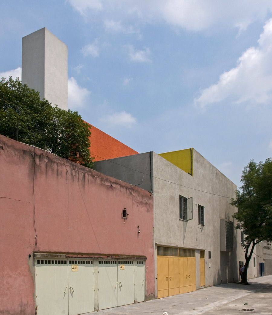 The street facade of Casa Barragan in Tacubaya, Mexico City, with its coloured upper volumes