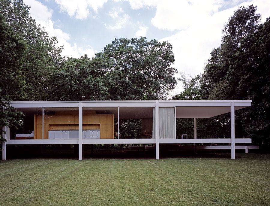 The Farnsworth House, Plano, Illinois, the white steel and glass pavilion floating above the meadow