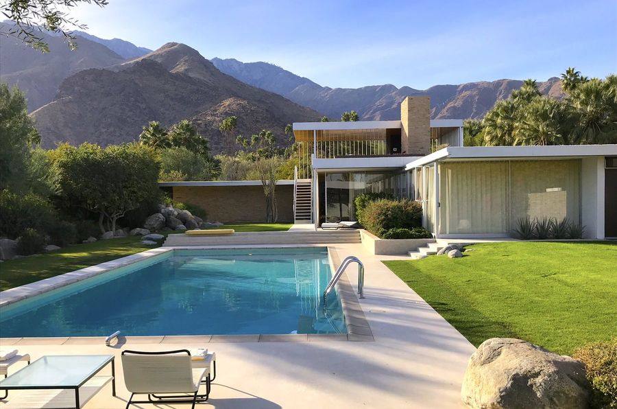 The Kaufmann Desert House, Palm Springs, seen from the pool deck with the San Jacinto mountains behind