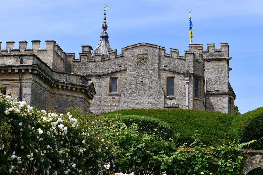 Rousham House, Oxfordshire, the battlemented stone facade above the gardens