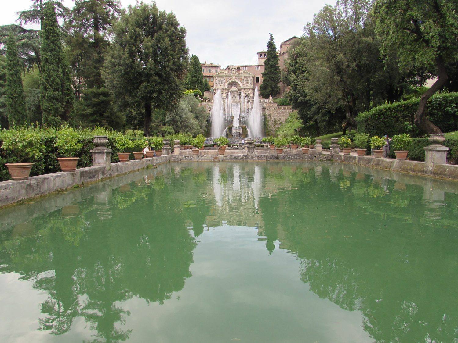 The Neptune Fountain's great water jets rising at the end of a long reflecting fish pond at Villa d'Este.