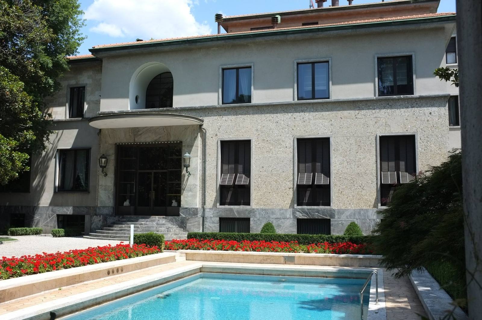 Villa Necchi Campiglio, Milan, the garden facade with the arched canopy and the heated swimming pool in the foreground